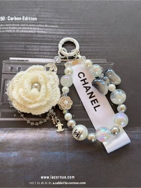 Handmade unbranded Crochet Camellia & Pearl phone Charm with Authentic CC Ribbon